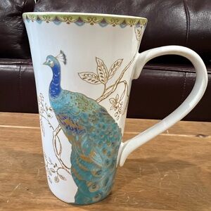 Beautiful Peacock tall coffee mug.Excellent condition.6 1/4”tall 3 3/4” across